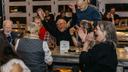 The winning trivia team celebrates at the third annual “Clink and Think” Quiz Bash Fundraiser on Oct. 26, 2025, at Axemann Brewery in Bellefonte.