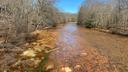 A stream along Coaldale Road in Rush Township, Centre County, runs orange from acid mine drainage. A stream along Coaldale Road in Rush Township, Centre County, runs orange from acid mine drainage.