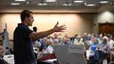Conor Lamb speaks to the crowd at a town hall-style event organized by progressive groups at Central Penn College in Enola, PA.
