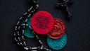 A photo of a rosary and sobriety chips. A photo of a rosary and sobriety chips.