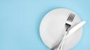 A stock image of a plate, fork, and knife.