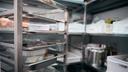 A stock image of a walk-in fridge in a restaurant.
