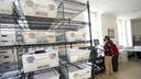Shelves of mail ballots.