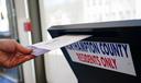 A voter puts a ballot into a drop box on primary Election Day 2024 at Bethlehem City Hall in Northampton County, Pennsylvania.