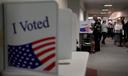 People fill out mail ballots for the 2024 election in West Chester, Pa.