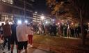 Pennsylvania State Police on horseback try to control a crowd on Penn State's campus.