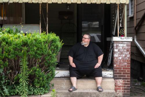 Mike Ramsey sits on the front porch of his house. Mike Ramsey sits on the front porch of his house.