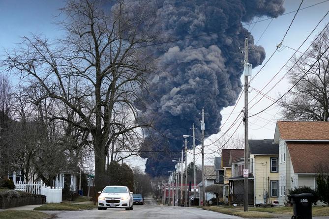 A black plume rises over East Palestine, Ohio, as a result of a controlled detonation of a portion of the derailed Norfolk Southern trains Monday, Feb. 6, 2023. A black plume rises over East Palestine, Ohio, as a result of a controlled detonation of a portion of the derailed Norfolk Southern trains Monday, Feb. 6, 2023.