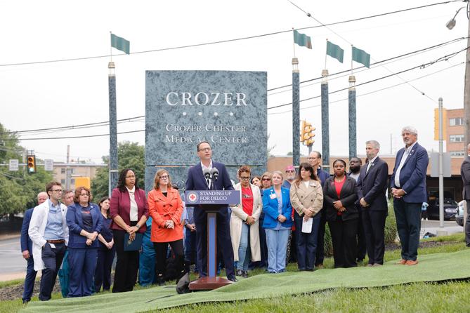 Gov. Josh Shapiro (center) joined health care workers, local leaders, and affected community members outside Crozer-Chester Medical Center in Delaware County. Gov. Josh Shapiro (center) joined health care workers, local leaders, and affected community members outside Crozer-Chester Medical Center in Delaware County.