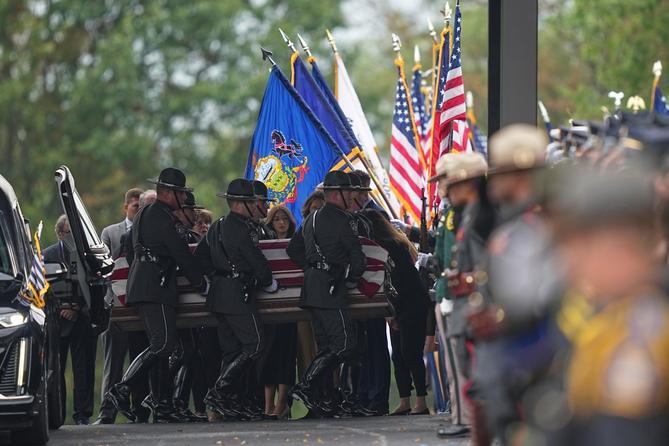 Pallbearers carry the coffin of a slain officer during funeral services for Northern York County Regional Police detectives in Red Lion, PA Pallbearers carry the coffin of a slain officer during funeral services for Northern York County Regional Police detectives in Red Lion, PA