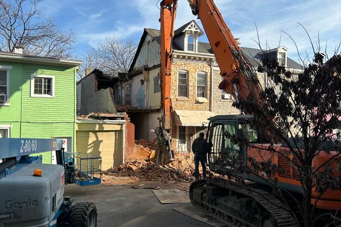 An emergency crew works to dismantle a Poplar Street home in Reading, following a partial building collapse.