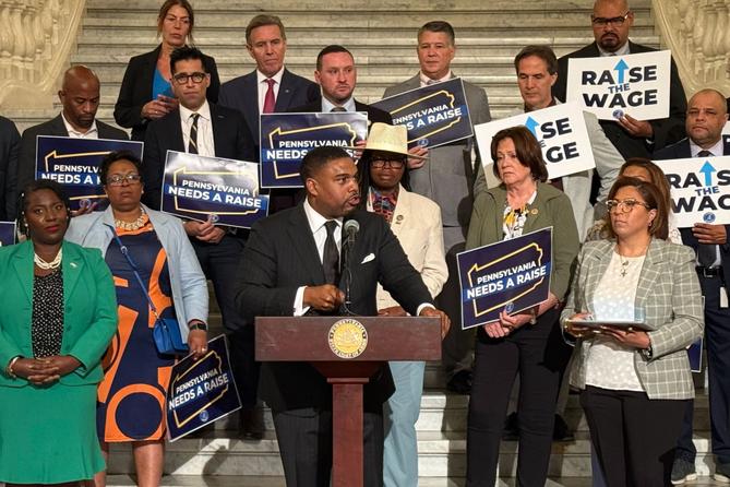 Rep. Jason Dawkins (center) speaks at a new conference urging the PA Senate to raise the minimum wage. Rep. Jason Dawkins (center) speaks at a new conference urging the PA Senate to raise the minimum wage.