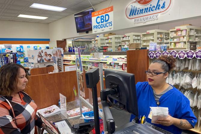Customer Lisa Durs is helped by pharmacy clerk Kira Tomoney at Minnich's Pharmacy in York County. Customer Lisa Durs is helped by pharmacy clerk Kira Tomoney at Minnich's Pharmacy in York County.