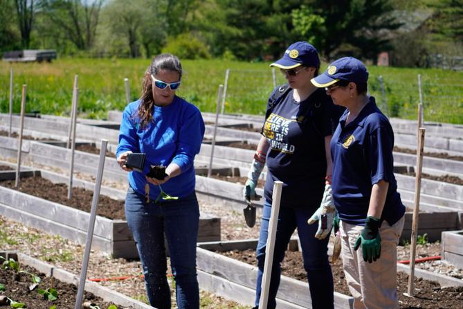 Garden of Health founder Carol Bauer and two other people at a farm. Garden of Health founder Carol Bauer and two other people at a farm.