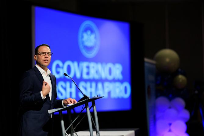 Gov. Josh Shapiro speaks at a podium.