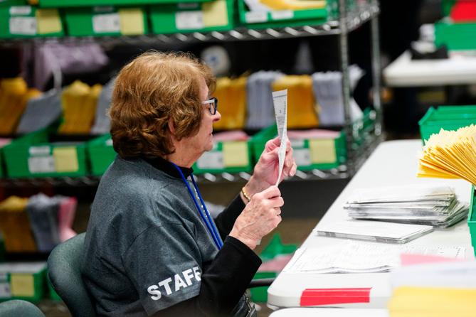 Lehigh County voter registration worker Ellen Ortt sorts mail ballots on Election Day 2023 in Allentown, Pennsylvania. Lehigh County voter registration worker Ellen Ortt sorts mail ballots on Election Day 2023 in Allentown, Pennsylvania.