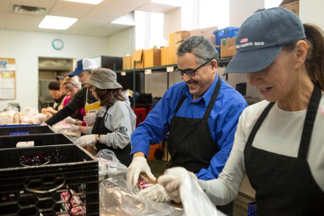 Volunteers prepare meals to deliver to older adults in Montgomery County in 2019. Volunteers prepare meals to deliver to older adults in Montgomery County in 2019.