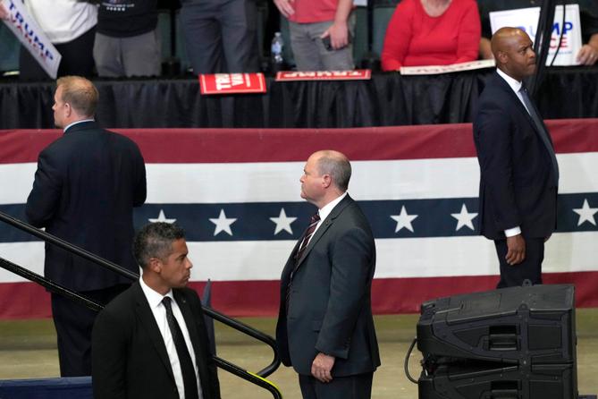 Members of the Secret Service look on as Republican presidential candidate former President Donald Trump speaks at a campaign event, July 20, 2024, in Grand Rapids, Mich. Members of the Secret Service look on as Republican presidential candidate former President Donald Trump speaks at a campaign event, July 20, 2024, in Grand Rapids, Mich.