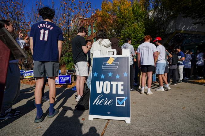 People wait in line to vote Nov. 5, 2024, at the Banana Factory in Bethlehem, Pa.