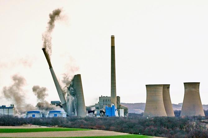 The smokestacks of the former coal-fired Homer City Generating Station crumble in a planned demolition in Homer City, Pa. The smokestacks of the former coal-fired Homer City Generating Station crumble in a planned demolition in Homer City, Pa.