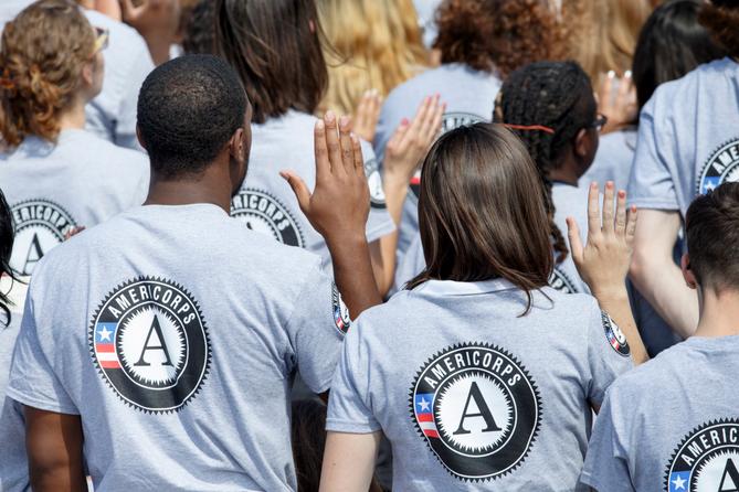 Hundreds of new AmeriCorps volunteers are sworn in for duty at a ceremony, Friday, Sept. 12, 2014, on the South Lawn of the White House in Washington. Hundreds of new AmeriCorps volunteers are sworn in for duty at a ceremony, Friday, Sept. 12, 2014, on the South Lawn of the White House in Washington.
