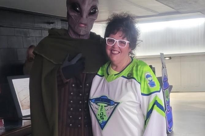 Carbondale Mayor Michele Bannon poses with an alien at a Carbondale UFOs — a one-night alternate identity for the Wilkes-Barre/Scranton Penguins — hockey game. Carbondale Mayor Michele Bannon poses with an alien at a Carbondale UFOs — a one-night alternate identity for the Wilkes-Barre/Scranton Penguins — hockey game.