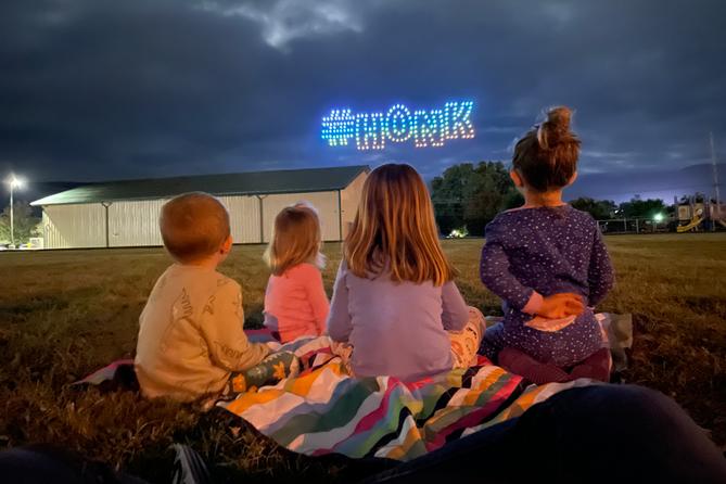 Children watch the inaugural Goose Day drone light show in downtown Lewistown in 2023. Children watch the inaugural Goose Day drone light show in downtown Lewistown in 2023.