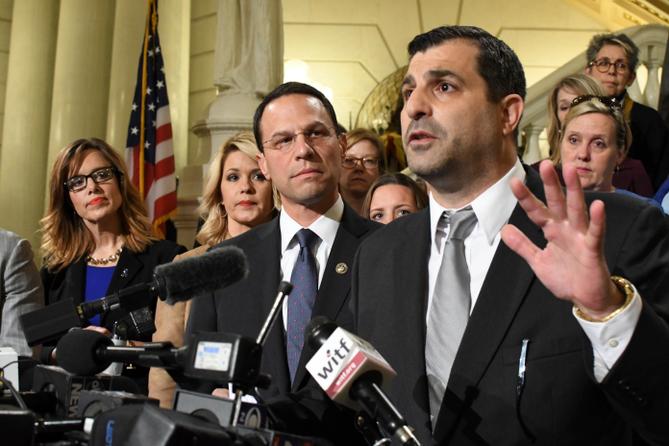 Then-state Rep. Mark Rozzi (D., Berks) speaks at a news conference in the Pennsylvania Capitol in October 2018. He is flanked by then-Attorney General Josh Shapiro, lawmakers, and abuse victims.