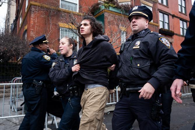 Police detain Emir Balat after he attempted to detonate an improvised explosive device during a counterprotest against far right influencer Jake Lang staging an anti-Islam protest outside Gracie Mansion, Saturday, March 7, 2026, in New York Police detain Emir Balat after he attempted to detonate an improvised explosive device during a counterprotest against far right influencer Jake Lang staging an anti-Islam protest outside Gracie Mansion, Saturday, March 7, 2026, in New York