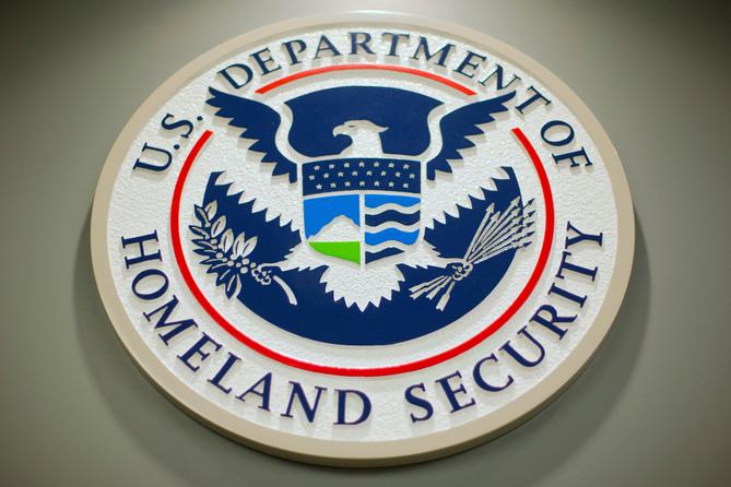 The Department of Homeland Security logo during a news conference in Washington, Feb. 25, 2015. The Department of Homeland Security logo during a news conference in Washington, Feb. 25, 2015.