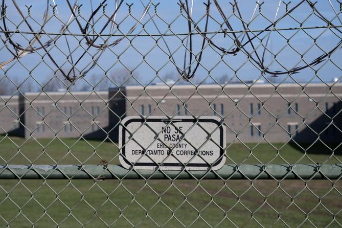 A sign on the fence surrounding Erie County's jail. A sign on the fence surrounding Erie County's jail.