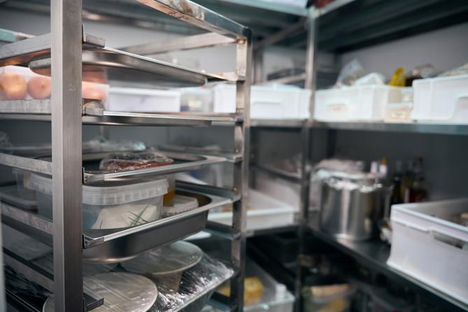 A stock image of a walk-in fridge in a restaurant.