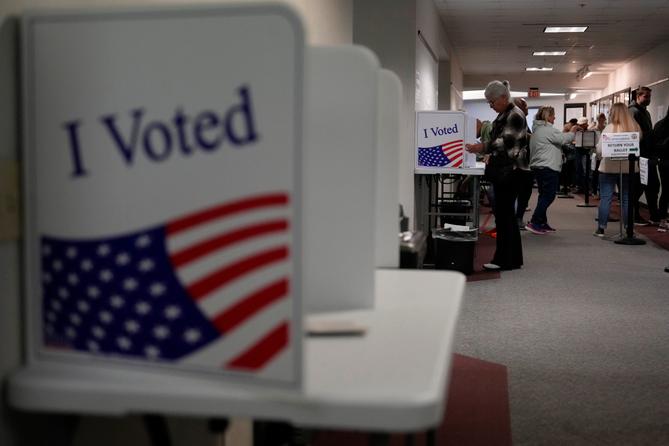 People fill out mail ballots for the 2024 election in West Chester, Pa. People fill out mail ballots for the 2024 election in West Chester, Pa.
