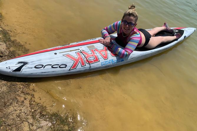 Amanda Parezo rides a paddleboard Amanda Parezo rides a paddleboard