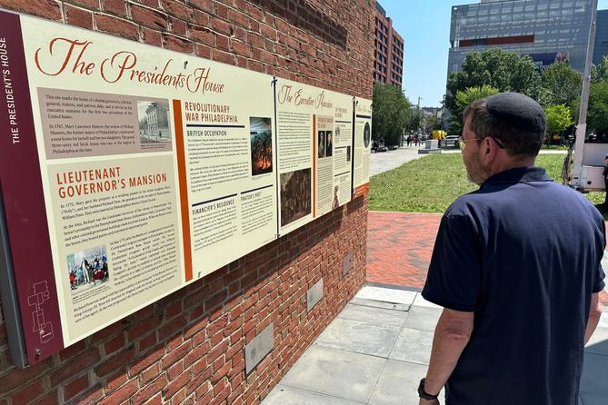 Visitors view the reinstalled educational panels about slavery at the site of President George Washington's home in Philadelphia, Wednesday, July 15, 2026. Visitors view the reinstalled educational panels about slavery at the site of President George Washington's home in Philadelphia, Wednesday, July 15, 2026.
