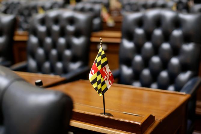 A miniature Maryland flag stands on a desk in the Maryland House of Delegates in Annapolis, Md., Wednesday, Jan. 14, 2015, the first day of the 2015 legislative session.