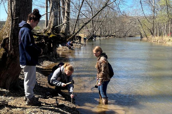 Volunteers with the Live Stake Collaborative plant stakes on the banks of Standing Stone Creek in Huntingdon County, PA.