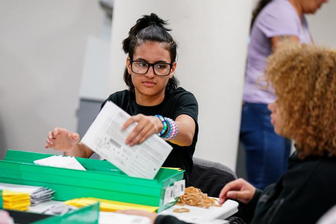 William Allen senior Liliana Delgado, of Allentown, opens and sorts mail-in ballots Nov. 8, 2022, at Lehigh County Government Center in Allentown, Lehigh County, Pennsylvania. 