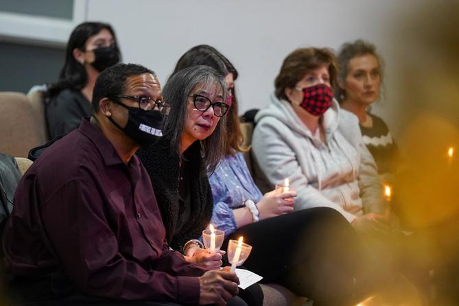 Gareth Hall, left, and his wife Fe Hall, right, look on during a vigil for their late son Christian Hall in December. Their lawsuit claims troopers used excessive force, killing Hall as he tried to surrender and after they said they would not shoot him. Gareth Hall, left, and his wife Fe Hall, right, look on during a vigil for their late son Christian Hall in December. Their lawsuit claims troopers used excessive force, killing Hall as he tried to surrender and after they said they would not shoot him.