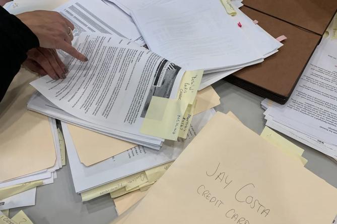 Piles of campaign finance records. Piles of campaign finance records.