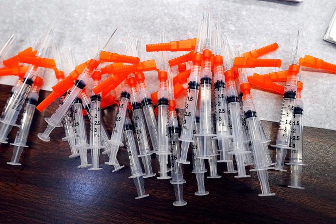 Syringes containing vaccines. Syringes containing vaccines.