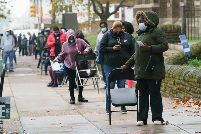 Some sites in Bucks County, Montgomery County, and Philadelphia (where voters are shown here, at Tilden Middle School) saw long lines of voters who wanted to request a mail ballot without having to risk U.S. Postal Service problems. Some sites in Bucks County, Montgomery County, and Philadelphia (where voters are shown here, at Tilden Middle School) saw long lines of voters who wanted to request a mail ballot without having to risk U.S. Postal Service problems.
