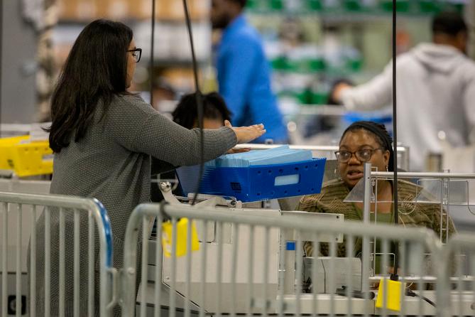 Mail-in ballots were processed in Philadelphia before going to flattening station. Mail-in ballots were processed in Philadelphia before going to flattening station.