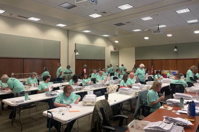 Poll workers process mail ballots in Lancaster County on Nov. 8, 2022. Poll workers process mail ballots in Lancaster County on Nov. 8, 2022.