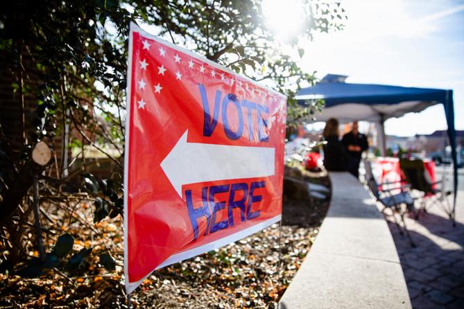A sign directing people to "vote here" is seen in Camp Hill, Pennsylvania on midterm Election Day 2022. A sign directing people to "vote here" is seen in Camp Hill, Pennsylvania on midterm Election Day 2022.