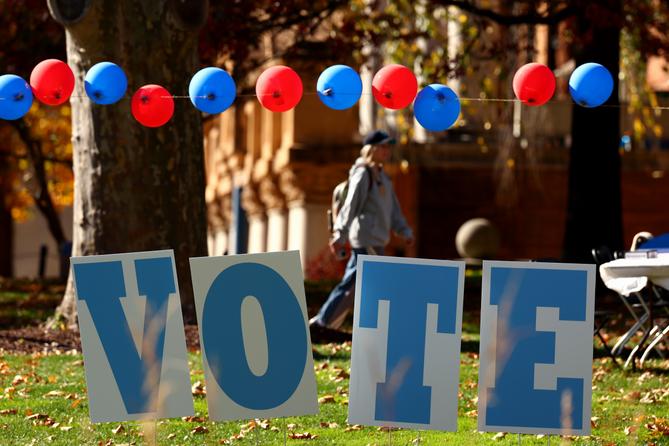 Students on the campus of the University of Pittsburgh walk past a ‘vote’ sign on Election Day, Nov. 5., 2024. Students on the campus of the University of Pittsburgh walk past a ‘vote’ sign on Election Day, Nov. 5., 2024.