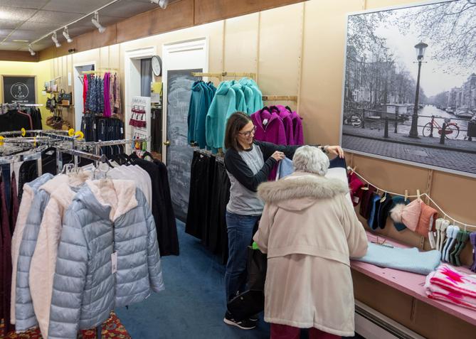 Julie Jackel helps a customer in her store, the Crooked Hem, in Kane, Pennsylvania. Julie Jackel helps a customer in her store, the Crooked Hem, in Kane, Pennsylvania.